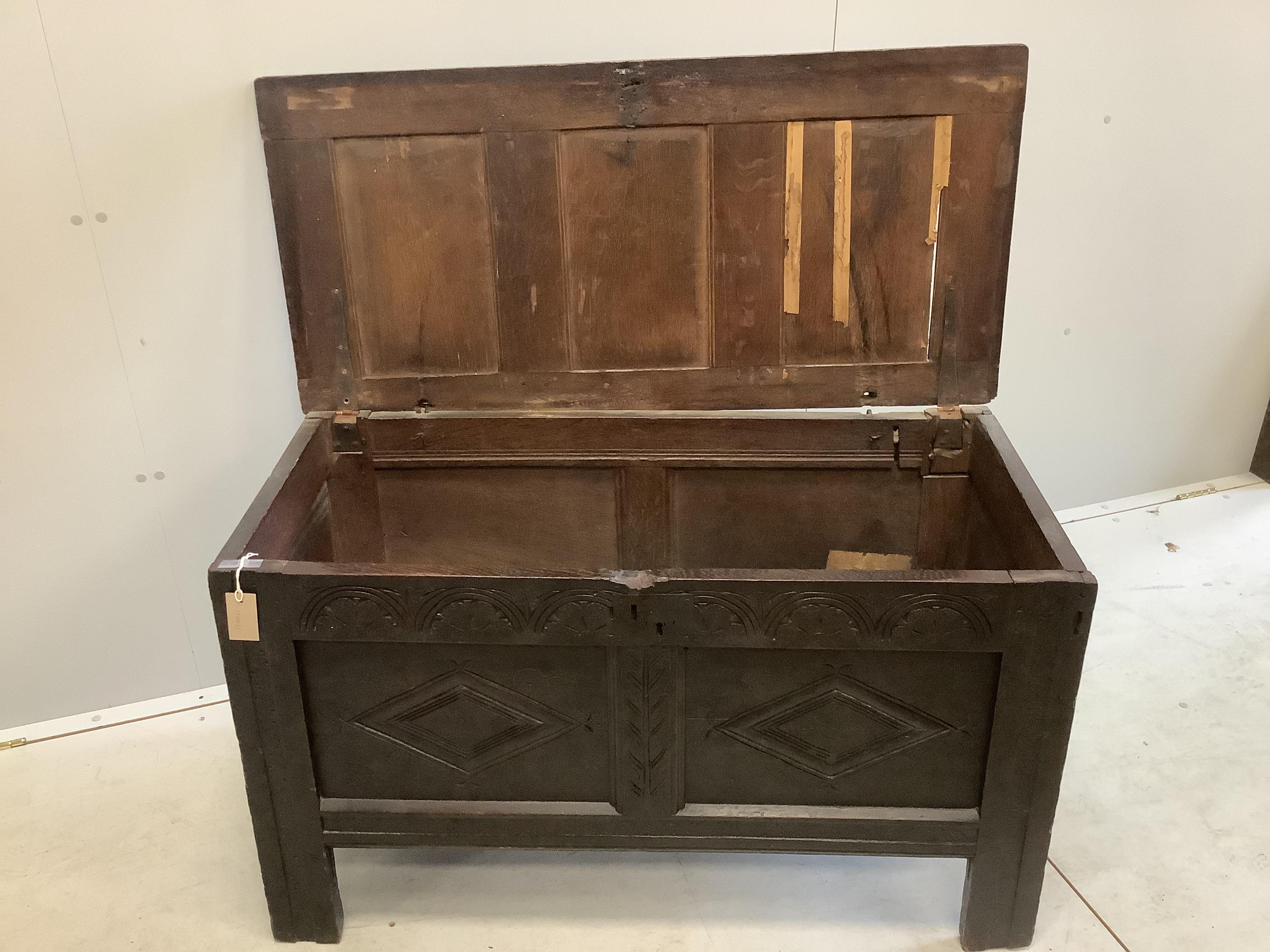 A 17th century oak coffer carved with initials A and C, width 110cm, depth 51cm, height 63cm